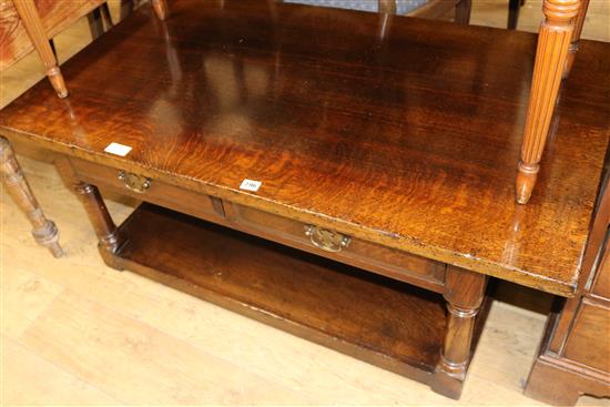 An oak coffee table W.122cm